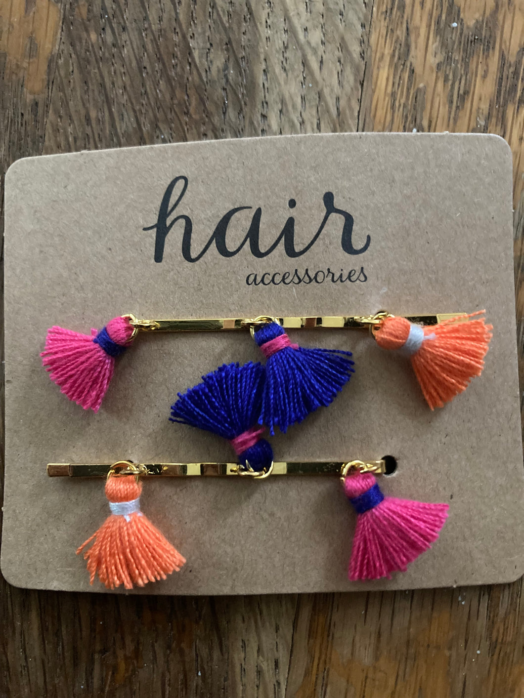 Scunci orange, blue & pink barrettes with tassel